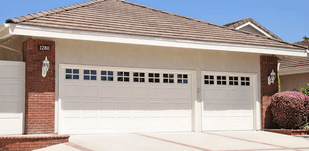 Residential garage door repair service for a double garage door in Manchester, NH